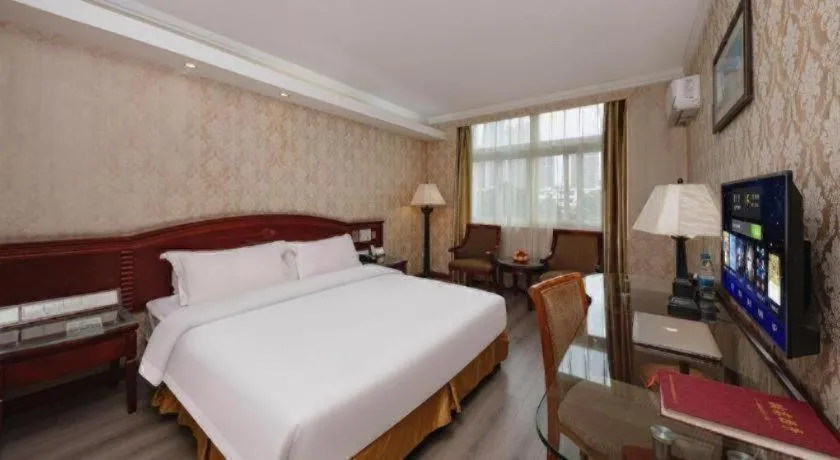 Bed in Zhenxing Hotel