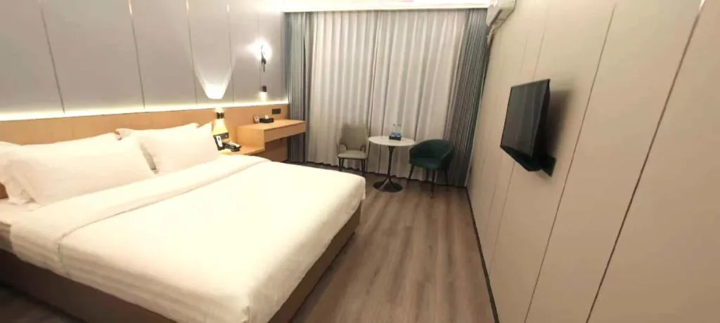 Bed in Zhenxing Hotel