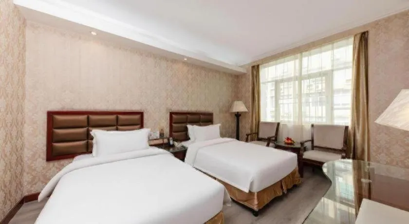 Bed in Zhenxing Hotel