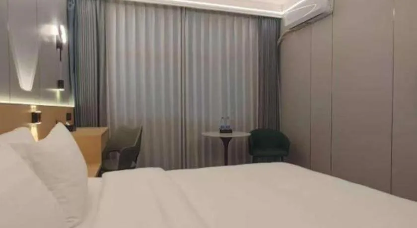 Bed in Zhenxing Hotel