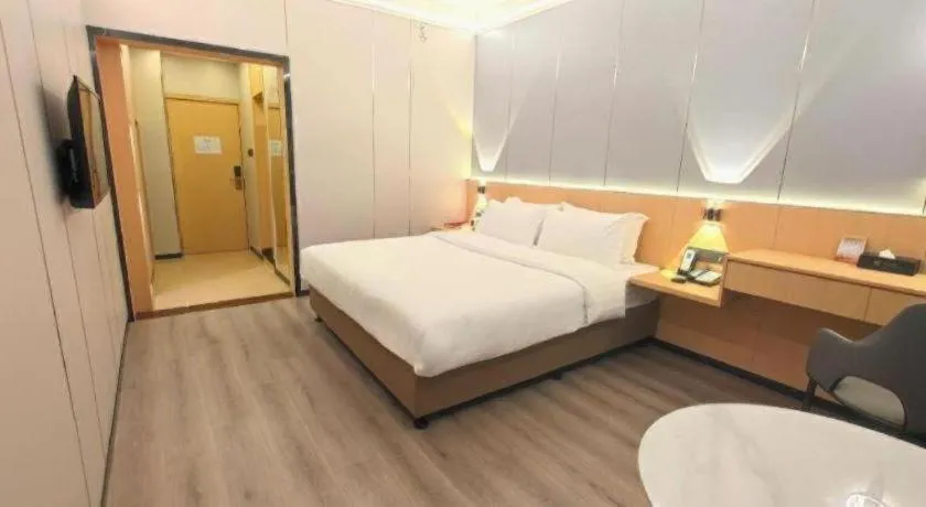 Bed in Zhenxing Hotel