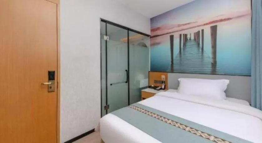 Bed in Zhenxing Hotel