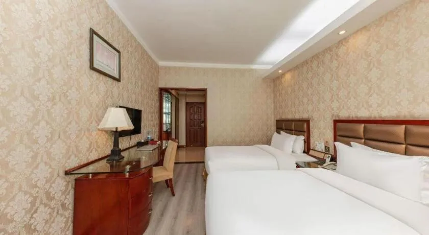 Bed in Zhenxing Hotel