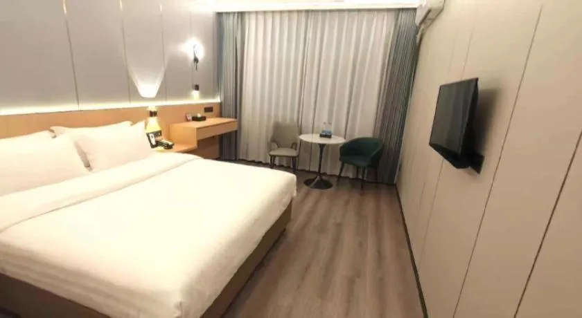 Bed in Zhenxing Hotel