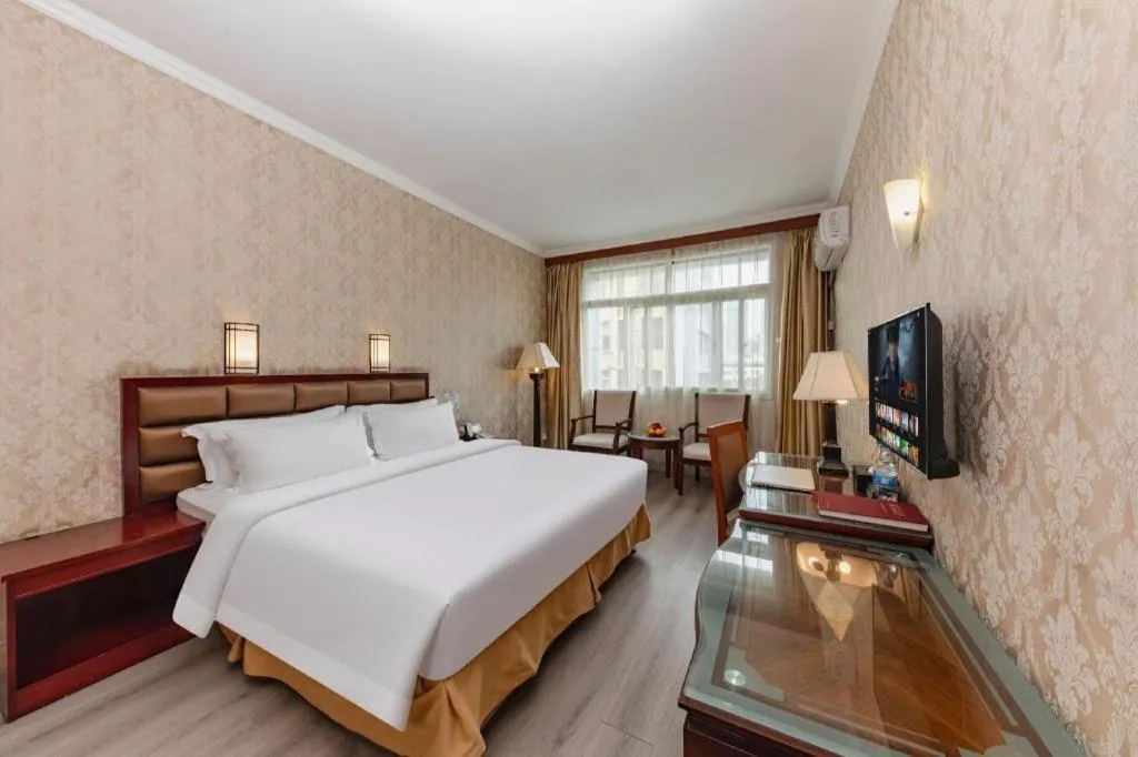 Bed in Zhenxing Hotel