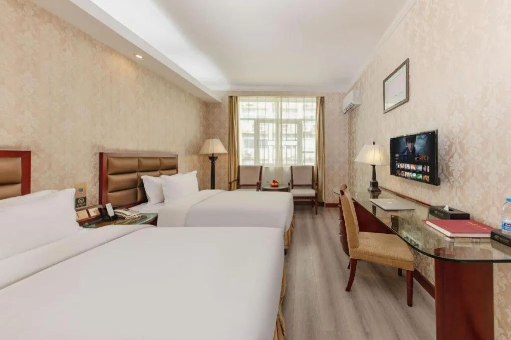 Bed in Zhenxing Hotel