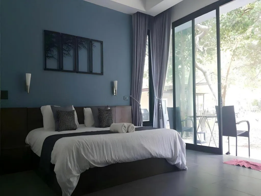 Bed in Baan Chao Mai Beach House