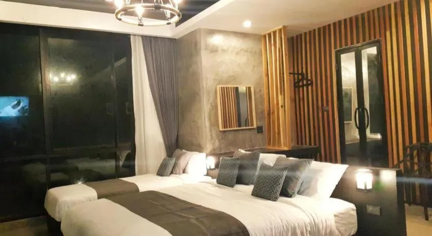 Bed in Baan Chao Mai Beach House