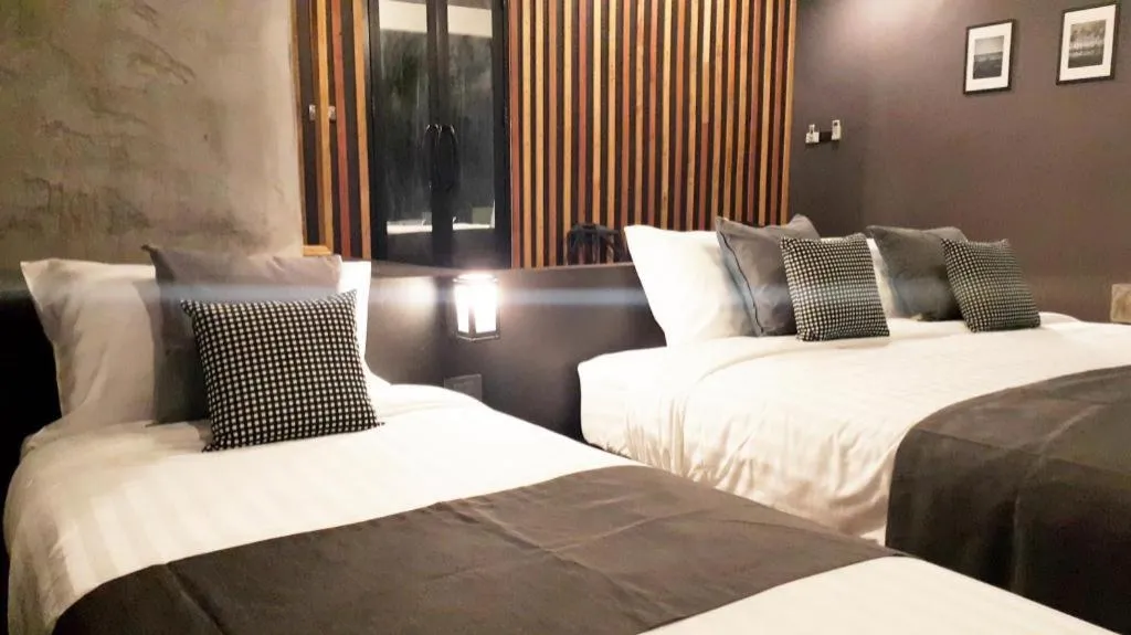 Bed in Baan Chao Mai Beach House