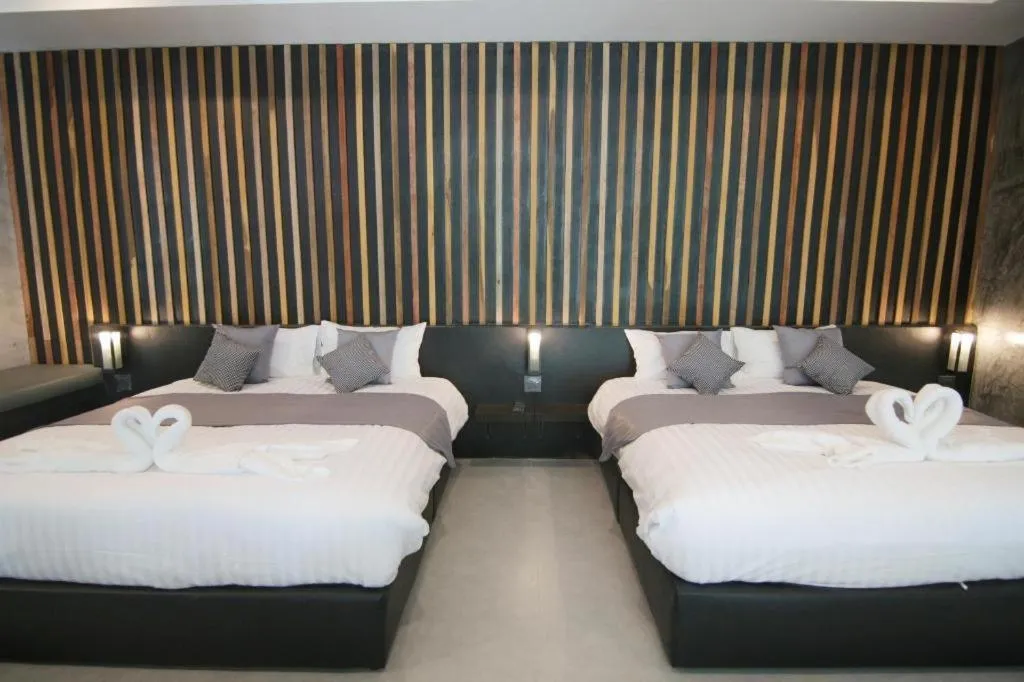 Bed in Baan Chao Mai Beach House