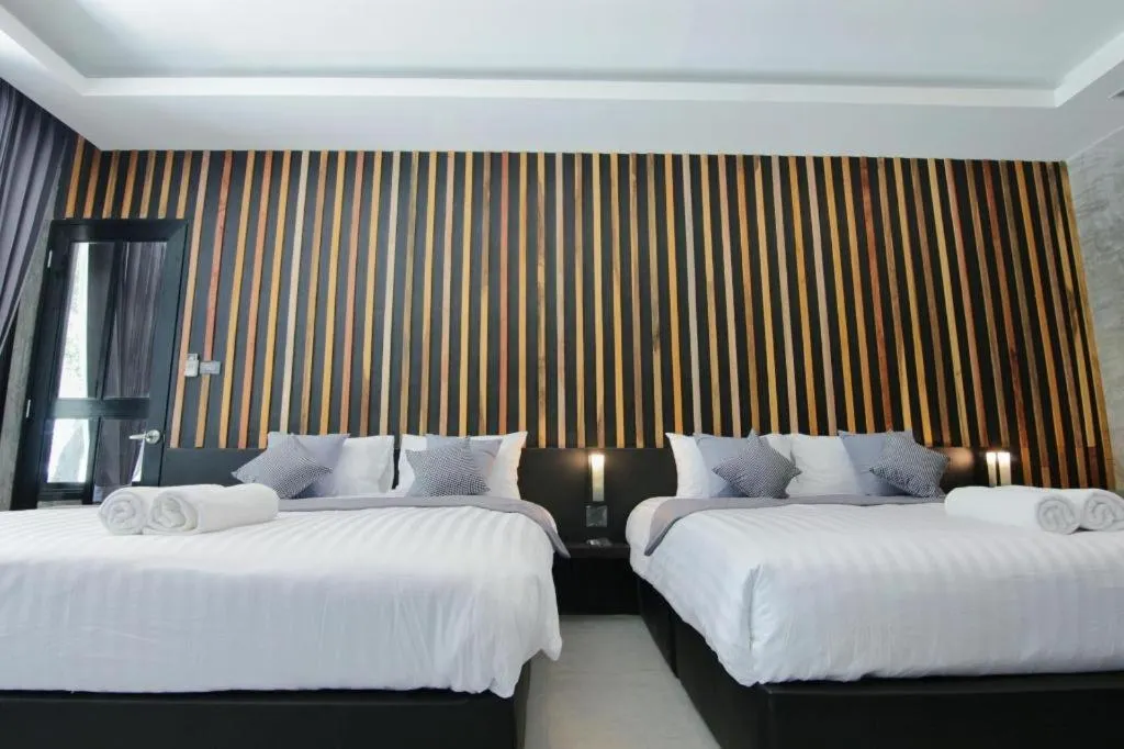 Bed in Baan Chao Mai Beach House