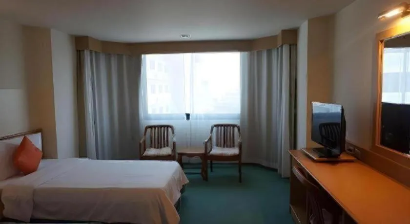 Bed in The Majestic Sakon Nakhon Hotel