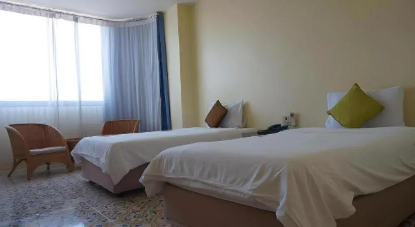 Bed in The Majestic Sakon Nakhon Hotel