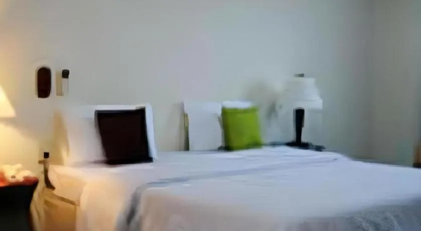 Bed in The Majestic Sakon Nakhon Hotel