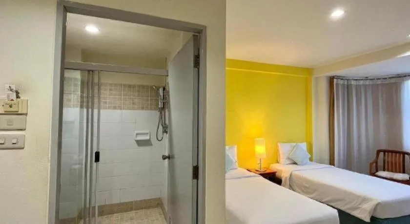 Bed in The Majestic Sakon Nakhon Hotel