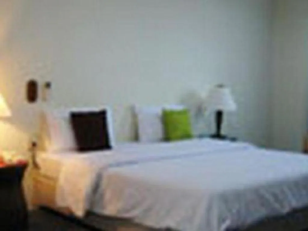 Bed in The Majestic Sakon Nakhon Hotel