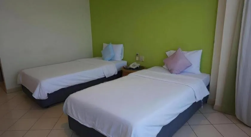 Bed in The Majestic Sakon Nakhon Hotel