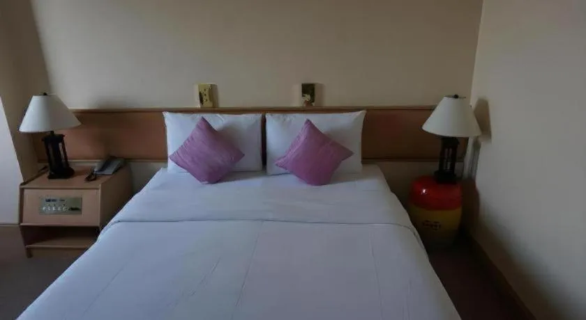 Bed in The Majestic Sakon Nakhon Hotel