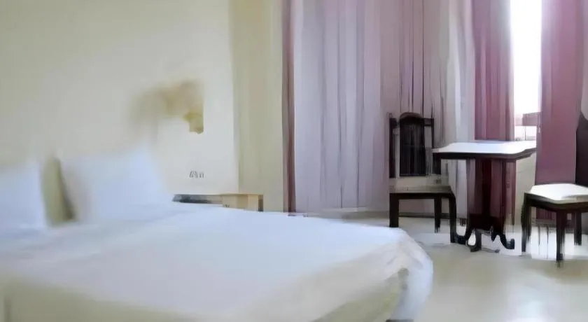 Bed in The Majestic Sakon Nakhon Hotel