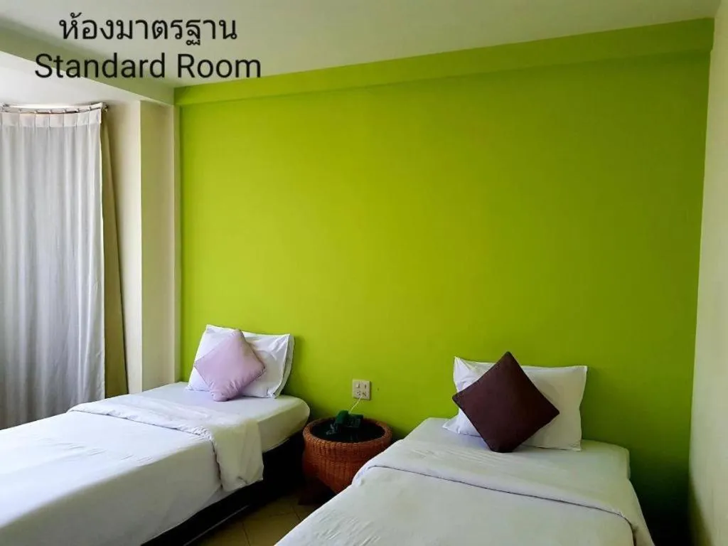 Bed in The Majestic Sakon Nakhon Hotel