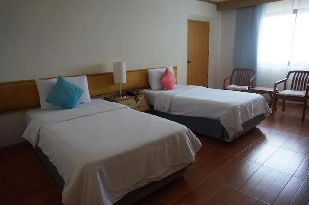 Bed in The Majestic Sakon Nakhon Hotel