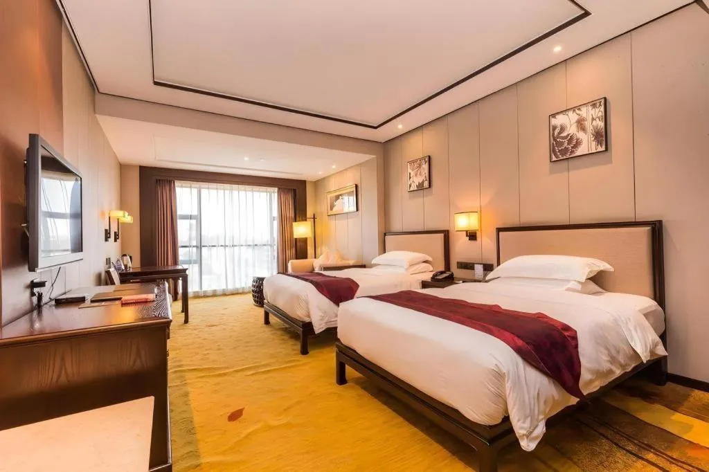 Bed in Xiang Yun Sha Garden Hotel