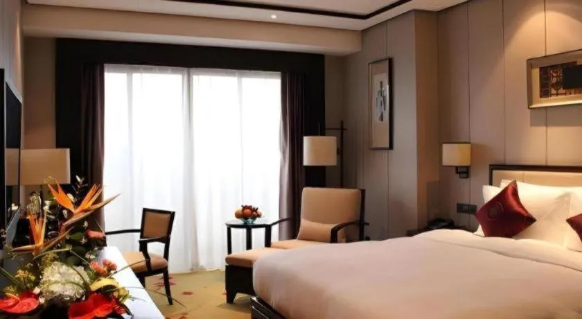 Bed in Xiang Yun Sha Garden Hotel