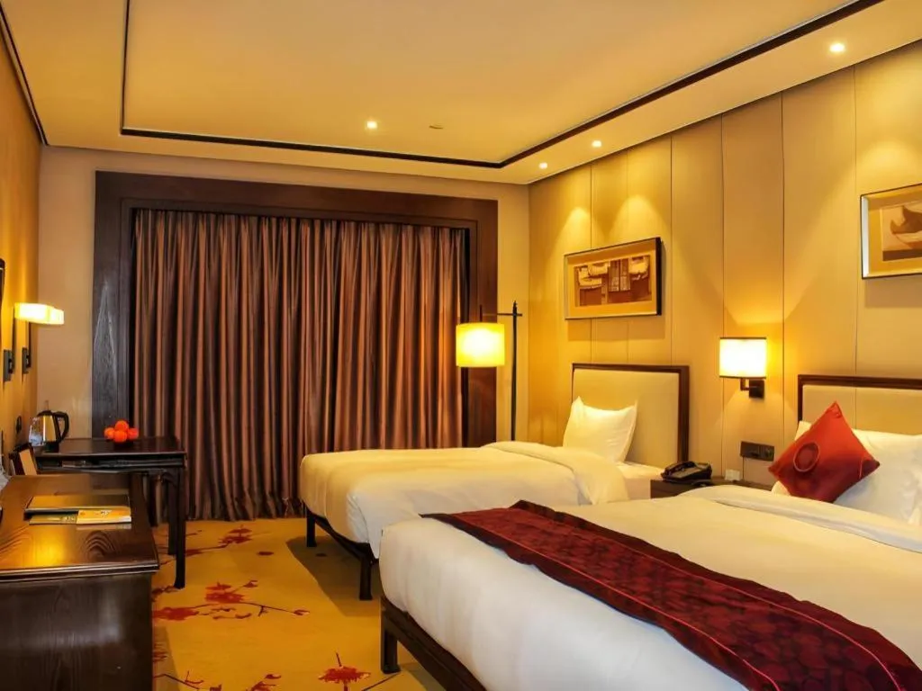 Bed in Xiang Yun Sha Garden Hotel