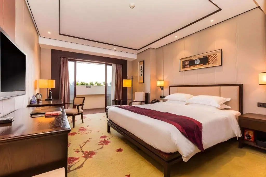 Bed in Xiang Yun Sha Garden Hotel
