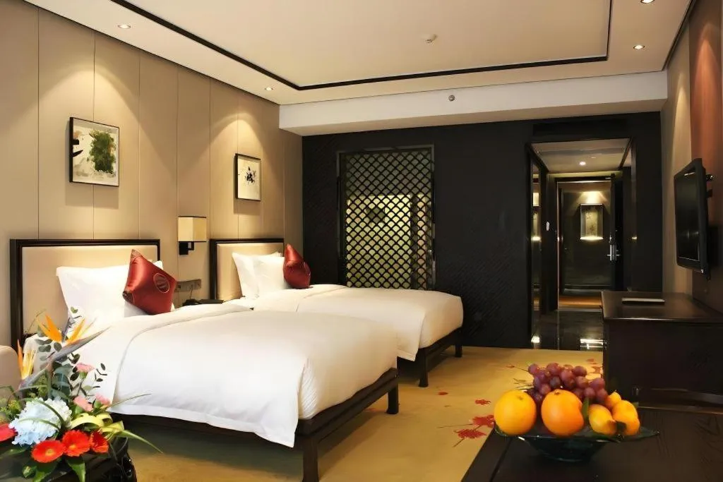 Bed in Xiang Yun Sha Garden Hotel