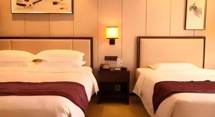 Bed in Xiang Yun Sha Garden Hotel