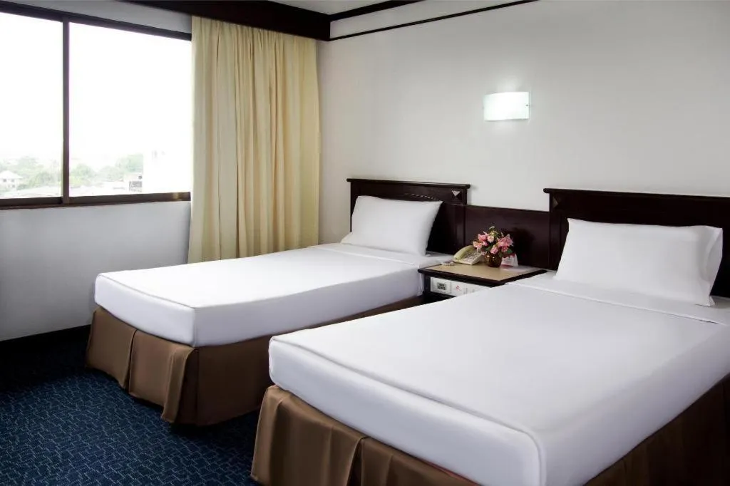 Bed in Hatyai Rama Hotel