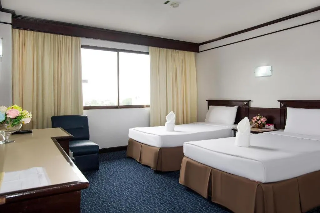 Bed in Hatyai Rama Hotel