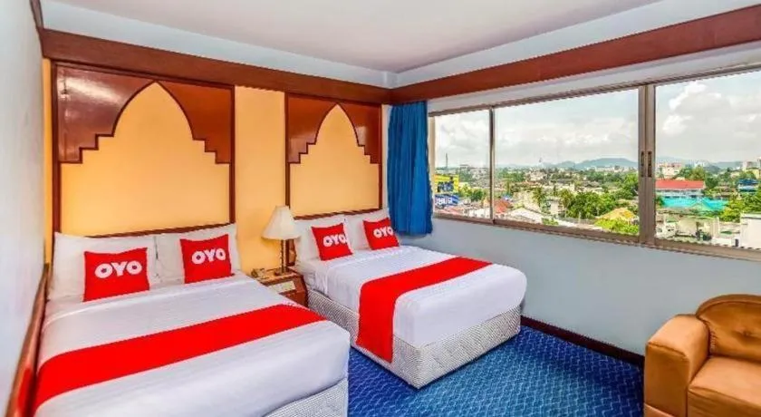 Bed in OYO 441 Grand Thara Hotel