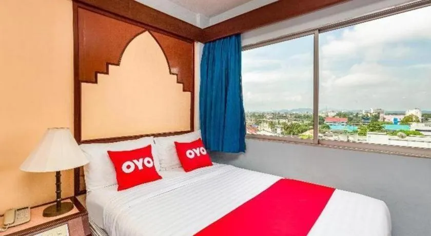 Bed in OYO 441 Grand Thara Hotel