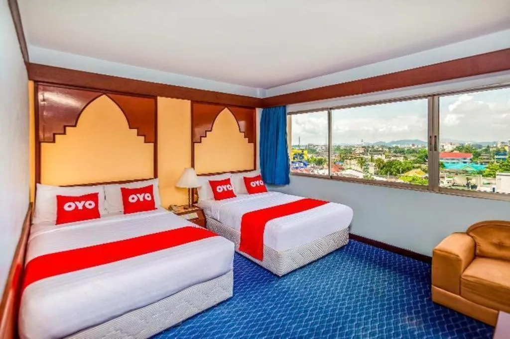 Bed in OYO 441 Grand Thara Hotel