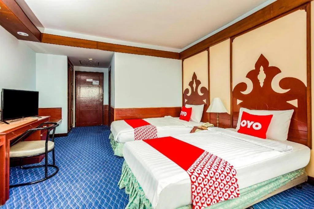 Bed in OYO 441 Grand Thara Hotel