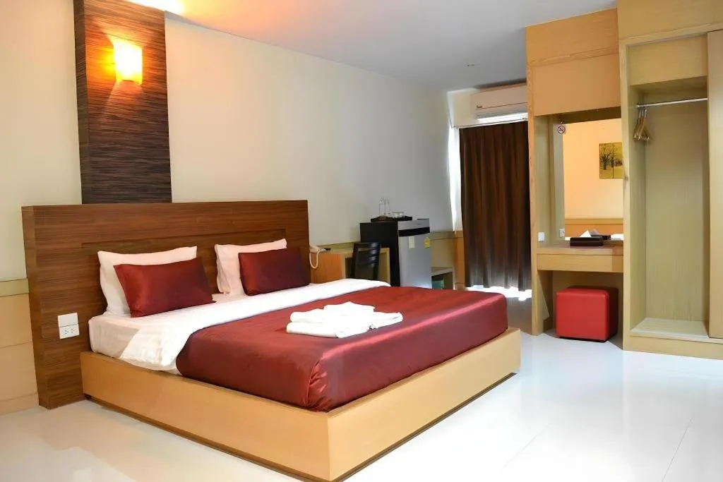 Bed in Amnauysuk Hotel