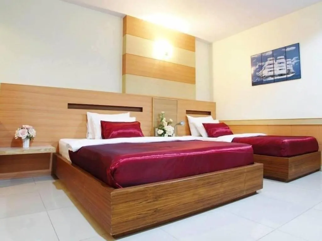 Bed in Amnauysuk Hotel