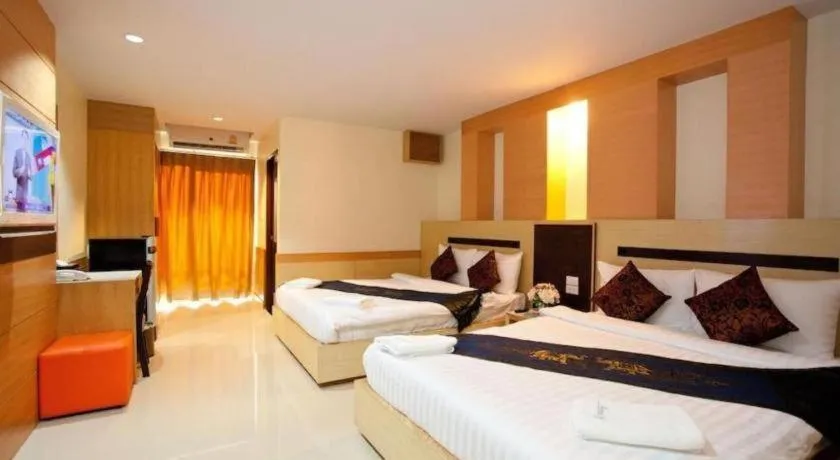 Bed in Amnauysuk Hotel