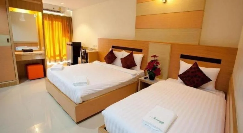 Bed in Amnauysuk Hotel