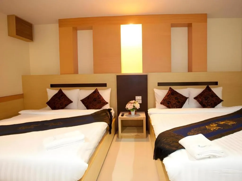 Bed in Amnauysuk Hotel