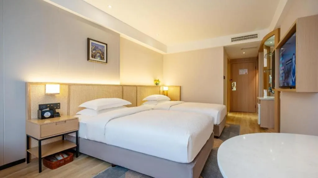 Bed in Gem Flower Jinyu Sunshine Hotel