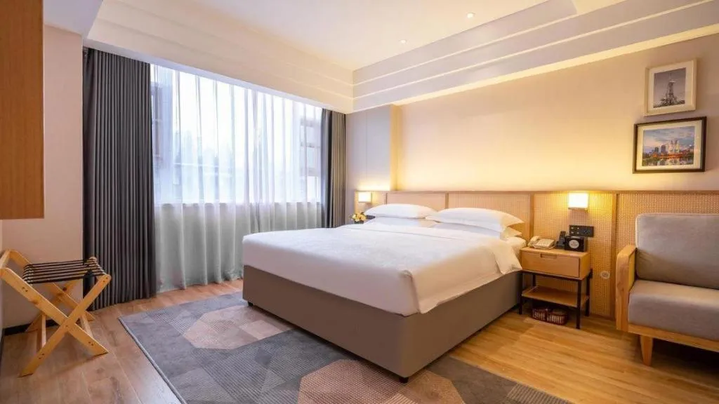 Bed in Gem Flower Jinyu Sunshine Hotel