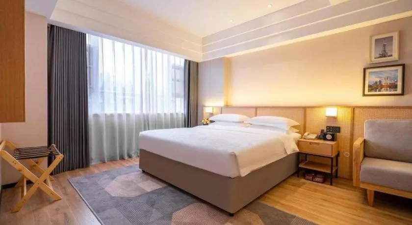 Bed in Gem Flower Jinyu Sunshine Hotel