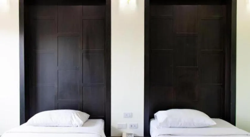 Bed in Baan Ingna Resort Hotel