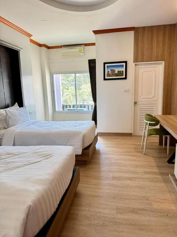 Bed in Baan Ingna Resort Hotel