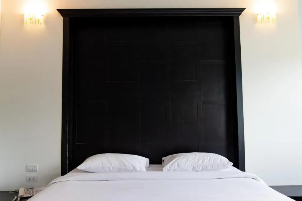 Bed in Baan Ingna Resort Hotel