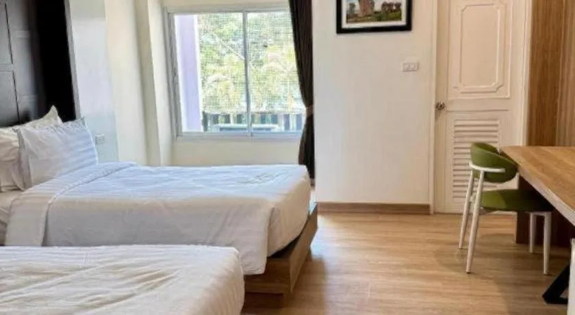 Bed in Baan Ingna Resort Hotel