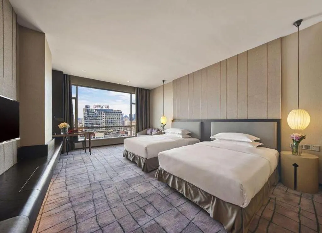 Bed in DongGuan JOYC Hotel 